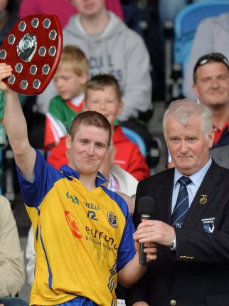 16 June 2013; Cathal Kelly, Roscommon, lifts the trophy alongside Uachtarán, Comhairle Chonnacht, Proinsias de Búrca. Connacht GAA Hurling Intermediate Championship Final, Mayo v Roscommon, Elverys MacHale Park, Castlebar, Co. Mayo. Picture credit: Barry Cregg / SPORTSFILE